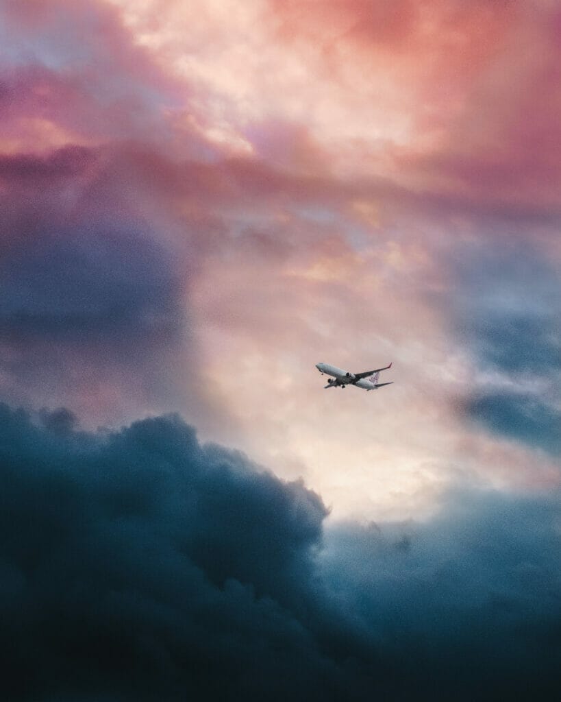 airplane flying through clouds