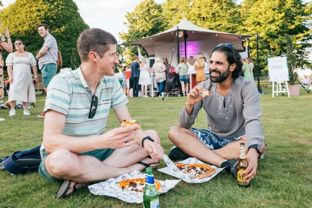 two men eating food at Hampton Court Palace Food Festival